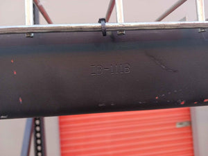 flat black 4' x 10' x 94" industrial steel rack with metal grated shelving